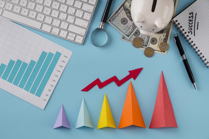 top view business items with growth chart colored cones scaled e1749996679807